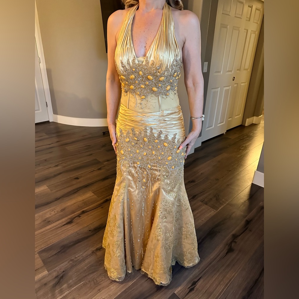 Beautiful and unique gold gown with jewels and stones